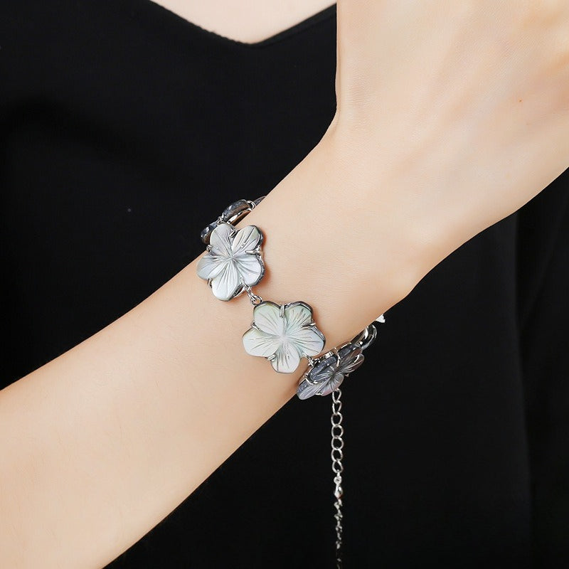 Natural black baby shell carved spiky bowl flower bracelet for women, lightweight and versatile wrist accessory