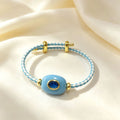 Hand-woven adjustable bracelet featuring crystals, gemstones, and gold threads—a colorful, mood-boosting accessory.
